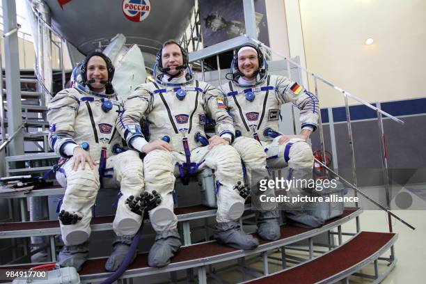German astronaut Alexander Gerst , Russian Sergej Prokopjew and American Serena Aunon-Chancellor sit in a simulator at the...