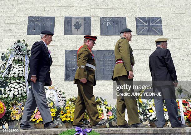 Military officers and veterans from the British Commonwealth countries, who fought alongside South Korea during the 1950-53 Korean War, walk past a...