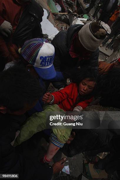 Year girl is rescued from the rubble following a strong earthquake on Jiegu township of China's Qinghai province on April 16, 2010 in Golmud, China....