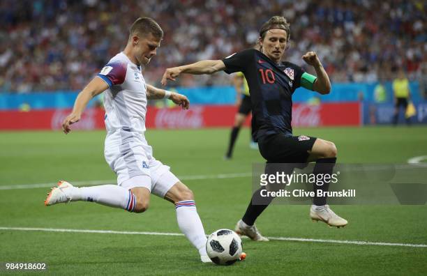Johann Gudmundsson of Iceland in action with Luka Modric of Croatia during the 2018 FIFA World Cup Russia group D match between Iceland and Croatia...