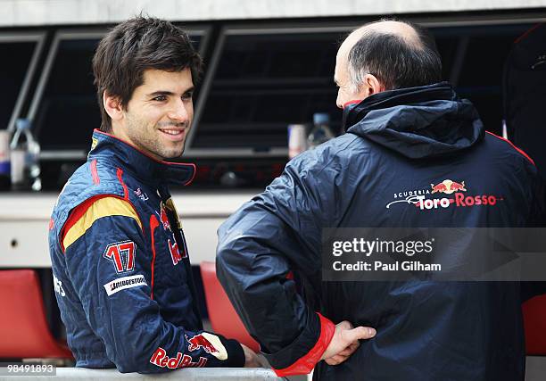 Jaime Alguersuari of Spain and Scuderia Toro Rosso is seen talking with his Team Principal Franz Tost as he prepares to drive during practice for the...