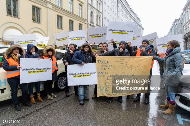 Taxi drivers protest against the appearance of Uber's CEO Dara Khosrowshahi at the innovation conference Digital-Life-Design in Munich, Germany, 22...