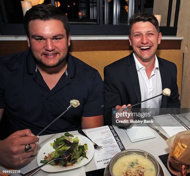 Jesse Bongiovi and NFL Indianapolis Colts offensive guard Quenton Nelson attend The Melting Pot of Red Bank Opening at Melting Pot on June 26, 2018...