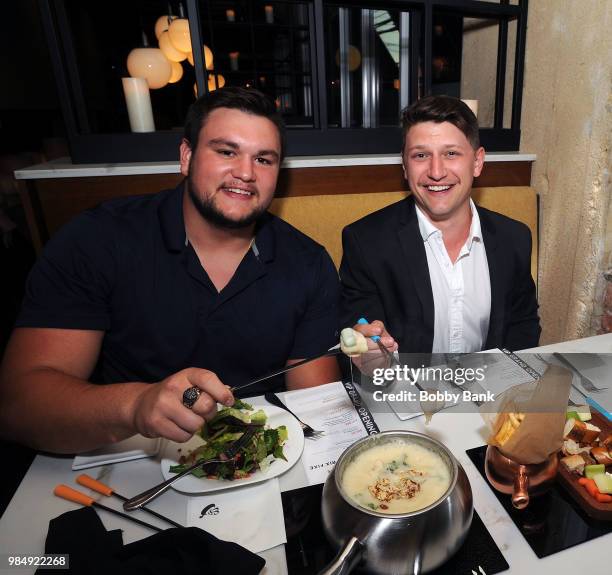 Jesse Bongiovi and NFL Indianapolis Colts offensive guard Quenton Nelson attend The Melting Pot of Red Bank Opening at Melting Pot on June 26, 2018...