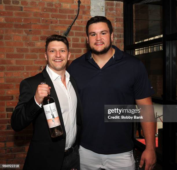 Jesse Bongiovi and NFL Indianapolis Colts offensive guard Quenton Nelson attend The Melting Pot of Red Bank Opening at Melting Pot on June 26, 2018...