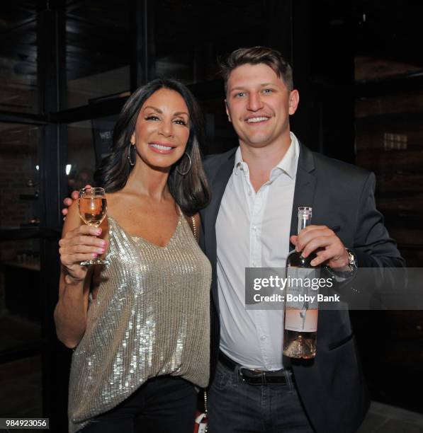 Jesse Bongiovi and Real Housewives of New Jersey Danielle Staub attend The Melting Pot of Red Bank Opening at Melting Pot on June 26, 2018 in Red...