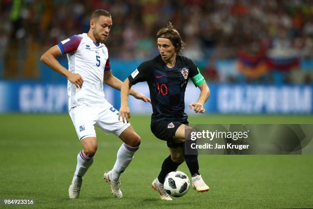 Luka Modric of Croatia controls the ball from Sverrir Ingason of Iceland during the 2018 FIFA World Cup Russia group D match between Iceland and...