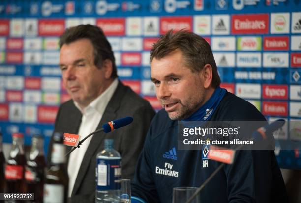 Bernd Hollerbach , new lead trainer of the Bundesliga team Hamburger SV, talks next to the CEO of HSV Soccer AG during a press conference in Hamburg,...
