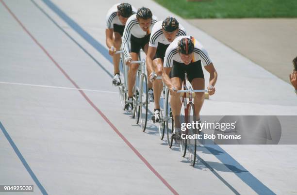 View of the West Germany cycling team competing to finish in bronze medal position in the Men's team pursuit cycling event at the 1984 Summer...