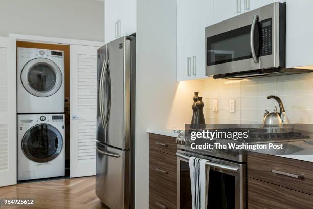 Kitchen area and Laundry in model unit 101 at Stone Hill on June 12, 2018 in Washington DC.
