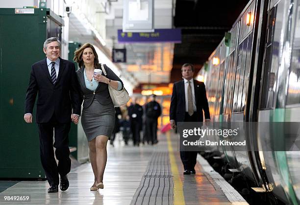 British Prime Minister Gordon Brown and his wife Sarah Brown board a train at Victoria Station on April 16, 2010 in London, England. The General...