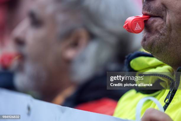 Ford workers participate in a warning strike in Cologne, Germany, 23 January 2018. The IG Metall called several ten thousands of employees for...