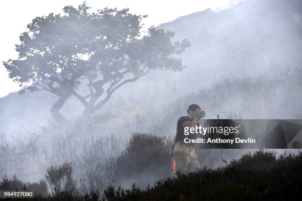 Fire officers continue to fight a large wildfire on the moors above Stalybridge, Greater Manchester on June 27, 2018 in Stalybridge, England....