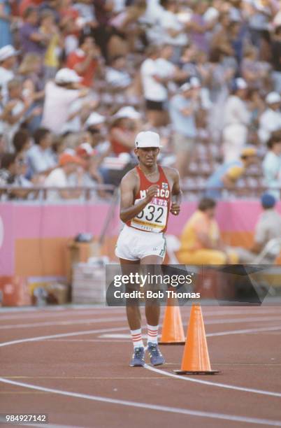 Mexican racewalker Ernesto Canto of the Mexico team competes to finish in first place to win the gold medal in the Men's 20 kilometres walk event...