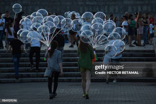 In this picture taken on June 26 young women sell balloons in Ekaterinburg, one of the host cities of the Russia 2018 World Cup football tournament.