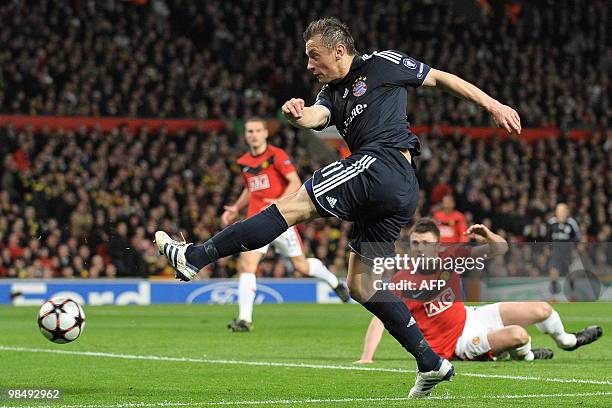 Bayern Munich's Croatian forward Ivica Olic gets past Manchester United's English midfielder Michael Carrick before scoring during the UEFA Champions...