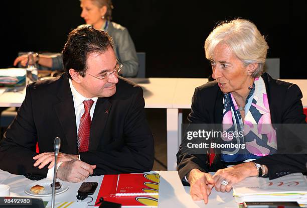 George Papaconstantinou, Greece's finance minister, left, speaks with Christine Lagarde, France's finance minister, before a European Union finance...