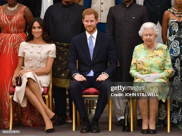 Meghan, Duchess of Sussex, Britain's Prince Harry, Duke of Sussex and Britain's Queen Elizabeth II pose for a picture during the Queen's Young...