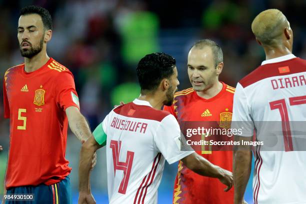 Sergio Busquets of Spain , Mbark Boussoufa of Morocco , Andres Iniesta of Spain during the World Cup match between Spain v Morocco at the Kaliningrad...