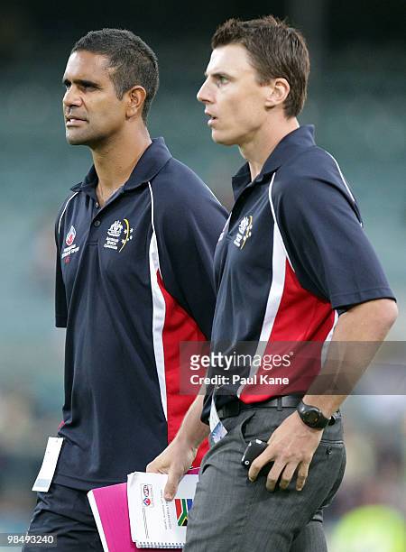 Coaches Michael O'Loughlin and Matthew Lloyd of the AIS look on during the trial match between the AIS AFL Academy and West Perth at Subiaco Oval on...