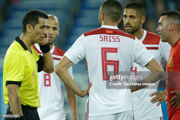 Referee Irmatov waiting for VAR, Karim El Ahmadi of Morocco , Romain Saiss of Morocco , Manuel Da Costa of Morocco ,Iago Aspas of Spain during the...