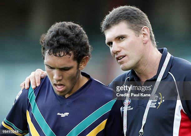 Jason McCartney coach of the AIS talks with Harley Bennell during the trial match between the AIS AFL Academy and West Perth at Subiaco Oval on April...