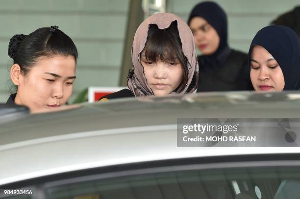 Vietnamese national Doan Thi Huong is escorted by Malaysian police after a court session for her trial at the Shah Alam High Court in Shah Alam,...