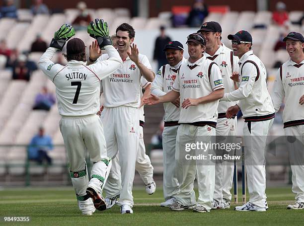 James Anderson of Lancashire celebrates taking the wicket of Jonathan Trott of Warwickshire during the LV County Championship match between...