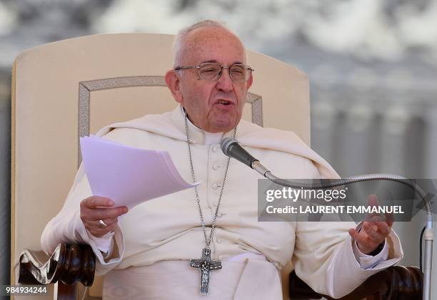 Pope Francis speaks at the St. Peters square at the Vatican during his weekly general audience on June 27, 2018.
