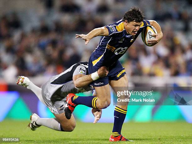 Adam Ashley-Cooper of the Brumbies is tackled during the round 10 Super 14 match between the Brumbies and the Hurricanes at Canberra Stadium on April...