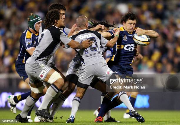 Adam Ashley-Cooper of the Brumbies runs the ball during the round 10 Super 14 match between the Brumbies and the Hurricanes at Canberra Stadium on...