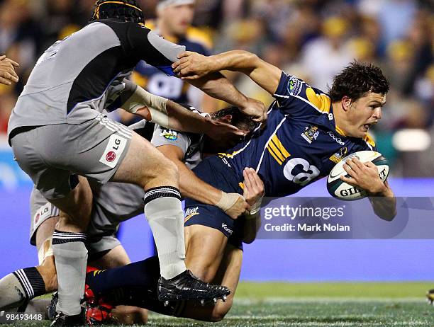 Adam Ashley-Cooper of the Brumbies is tackled during the round 10 Super 14 match between the Brumbies and the Hurricanes at Canberra Stadium on April...