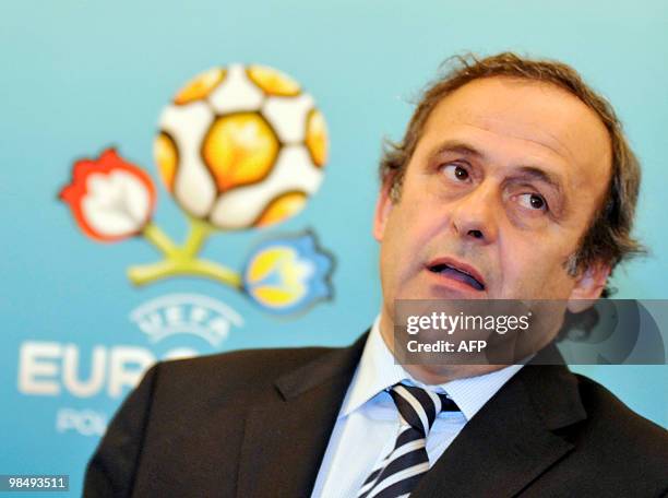 President Michel Platini gestures as he speaks a press-conference following his inspection of the construction site of the Lviv stadium in Lviv on...