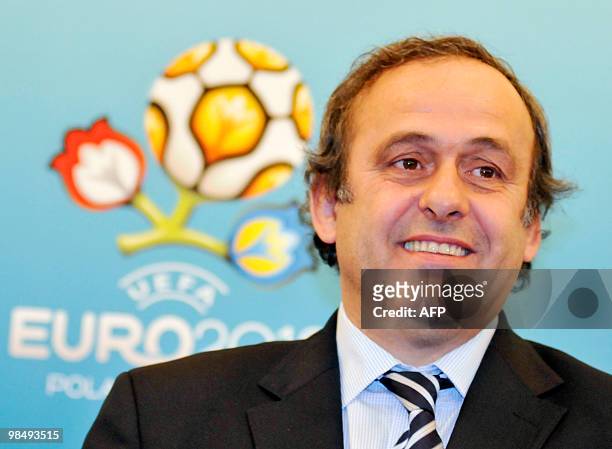 President Michel Platini gastures as he speaks a press-conference following his inspection of the construction site of the Lviv stadium in Lviv on...