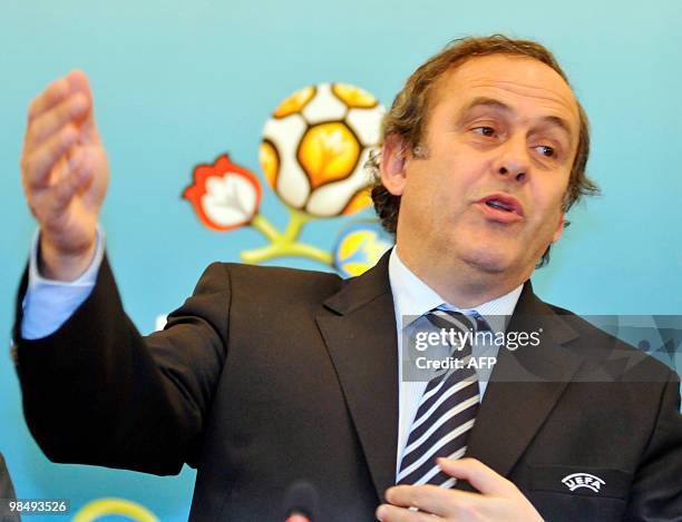 President Michel Platini gastures as he speaks during his press-conference for the results of the inspecting visit to western Ukrainian city of Lviv...