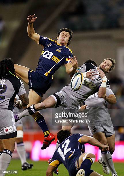 Adam Ashley-Cooper of the Brumbies and Cory Jane of the Hurricanes contest a high ball during the round 10 Super 14 match between the Brumbies and...