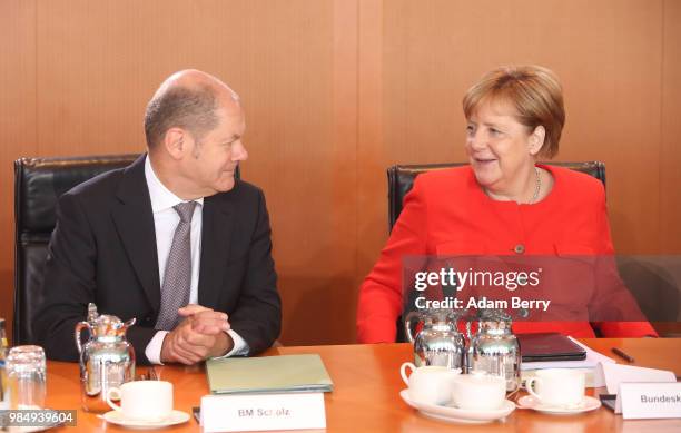 German Federal Chancellor Angela Merkel and Finance Minister and Vice Chancellor Olaf Scholz arrive for the weekly German federal Cabinet meeting on...