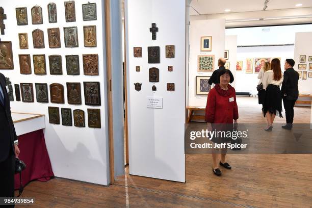 People gather to look at the art at the Prince's Foundation School of Traditional Arts degree show in Shoreditch on June 27, 2018 in London, England....