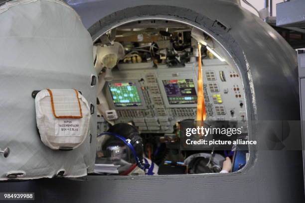 The German astronaut Alexander Gerst and his colleagues, Russian Sergey Prokopyev and US-American Serena Auñón-Chancellor sit in a simulator of a...