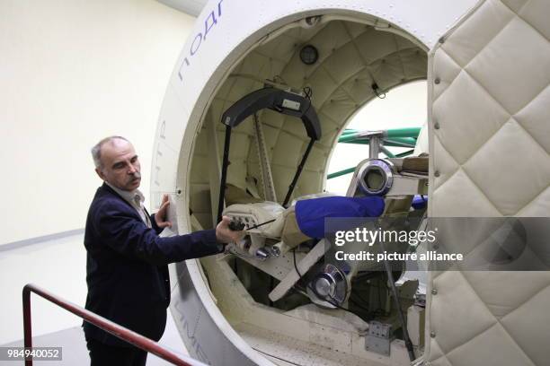 Alexander Jufkin, head of the training unit, shows the centrifuge CF-7 at the Yuri Gagarin Cosmonaut Training Center in Moscow, Russia, 19 January...