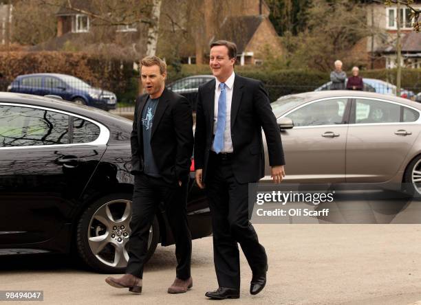 David Cameron , the leader of the Conservative party, arrives with singer Gary Barlow to visit Brine Leas High School on April 16, 2010 in Nantwich,...