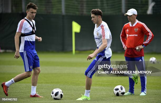 Russia's midfielder Aleksandr Golovin and Russia's forward Aleksey Miranchuk take part in a training session in Novogorsk, on June 27 ahead of the...