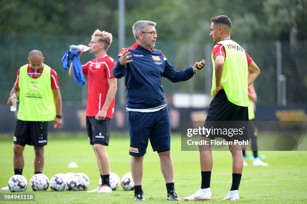 Coach Urs Fischer talks to Kenny Prince Redondo of 1 FC Union Berlin during the first training of season 2018/2019 at Trainingsgelaende of Stadion an...