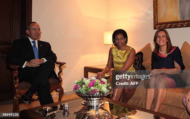 First Lady Michelle Obama talks with Mexican President Felipe Calderon and Mexican firts Lady Margarita Zavala at Los Pinos presidential house in...