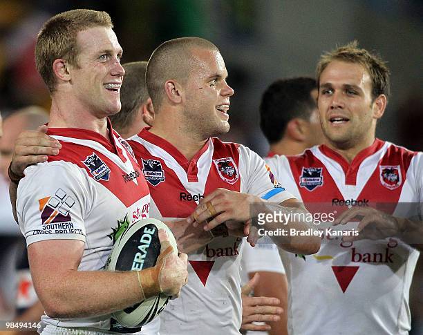 Ben Creagh of the Dragons celebrates with team mates after scoring a try during the round six NRL match between the Gold Coast Titans and the St...