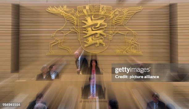 The coat of arms of the state of Baden-Wuerttemberg hanging in the plenary hall of the Landestag in Stuttgart, Germany, 24 January 2018 . Delegates...