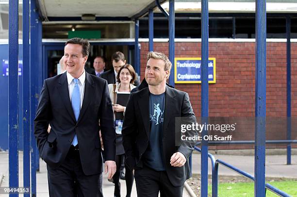 David Cameron , the leader of the Conservative party, and singer Gary Barlow visit Brine Leas High School on April 16, 2010 in Nantwich, England. The...