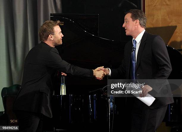 David Cameron , the leader of the Conservative party, and singer Gary Barlow visit Brine Leas High School on April 16, 2010 in Nantwich, England. The...