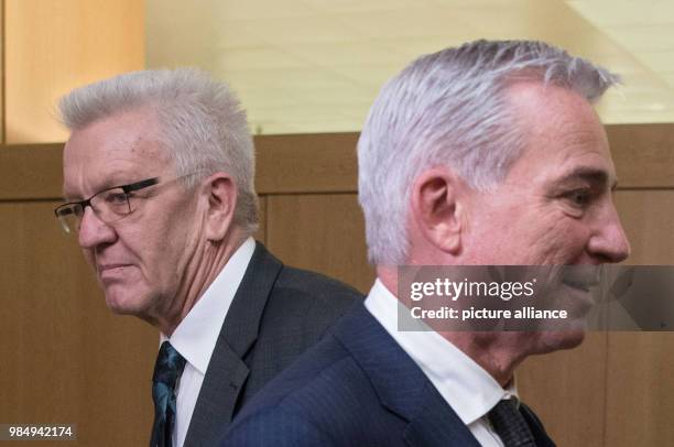 Winfried Kretschmann , Premier of the state of Baden-Wuerttemberg walking past Thomas Strobl , Minister of the Interior of the state of...