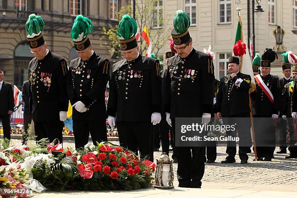 Polish miners' delegation lays wreaths in memory of late Polish President Lech Kaczynski and his wife Maria outside the Presidential Palace on April...